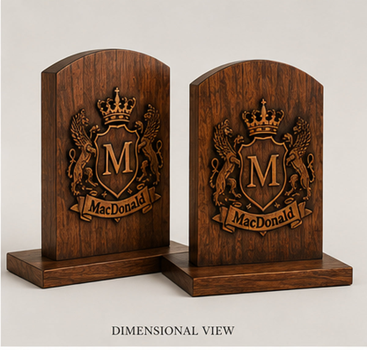 Dimensional angled view of a matched pair of personalized family crest bookends showing layered wood construction and display bases