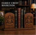 Personalized family crest bookends shown in a warm library setting with dimensional heraldic engraving and dark walnut finish