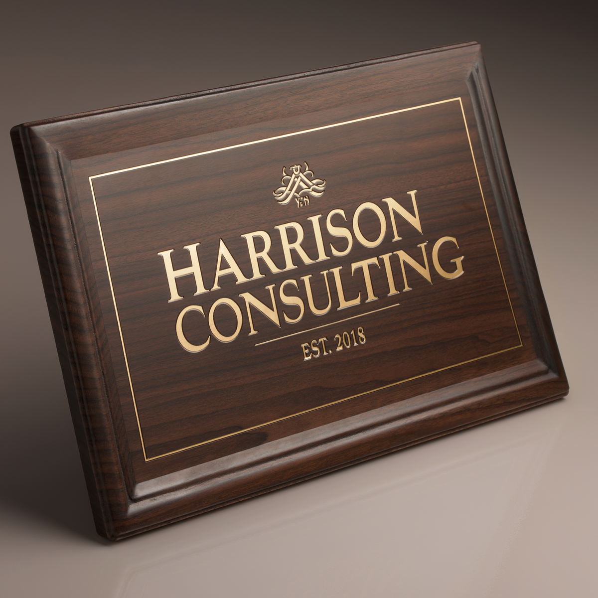 Harrison Consulting walnut office sign close-up showing engraving and wood grain