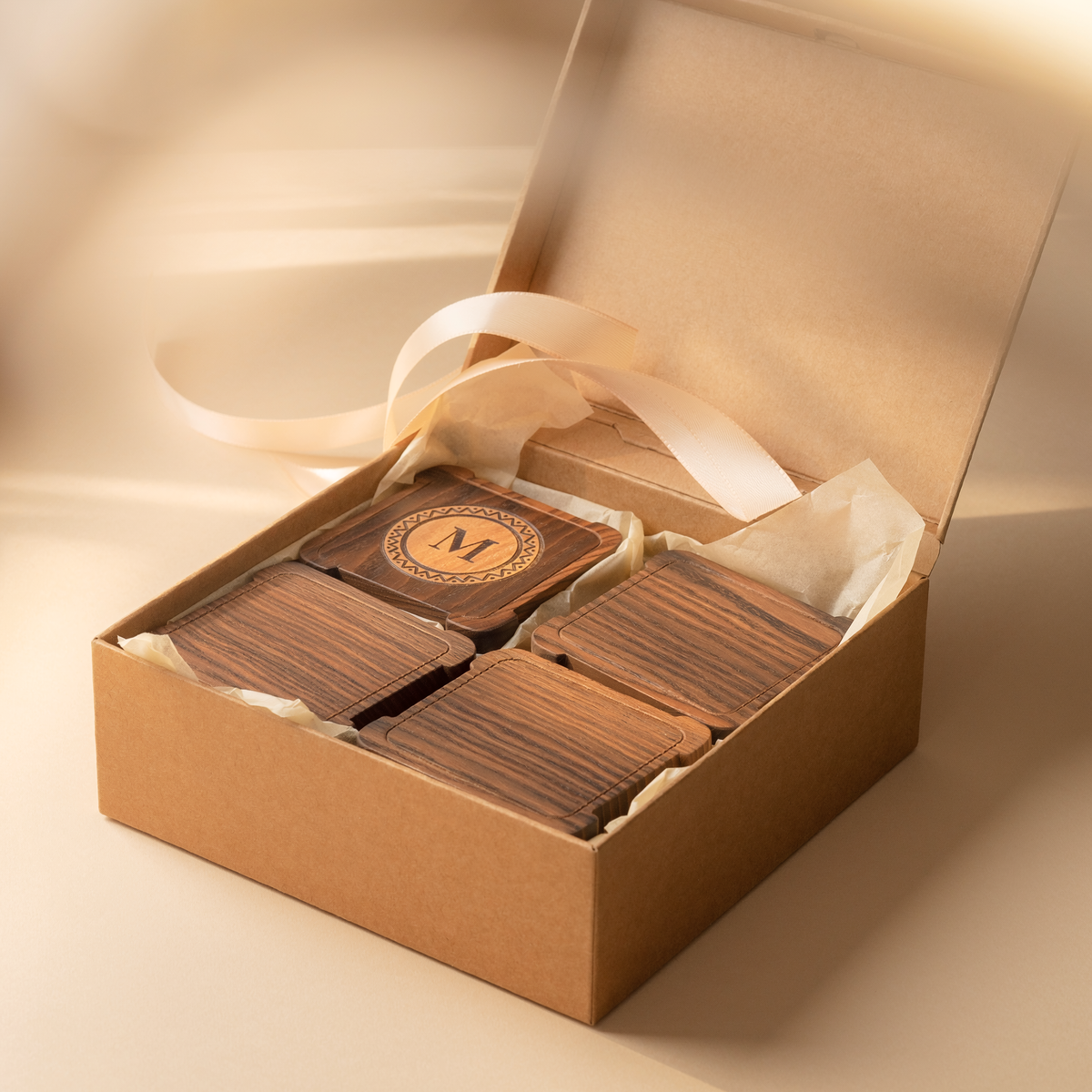 Matching square dark walnut monogram coaster set in fitted premium gift packaging