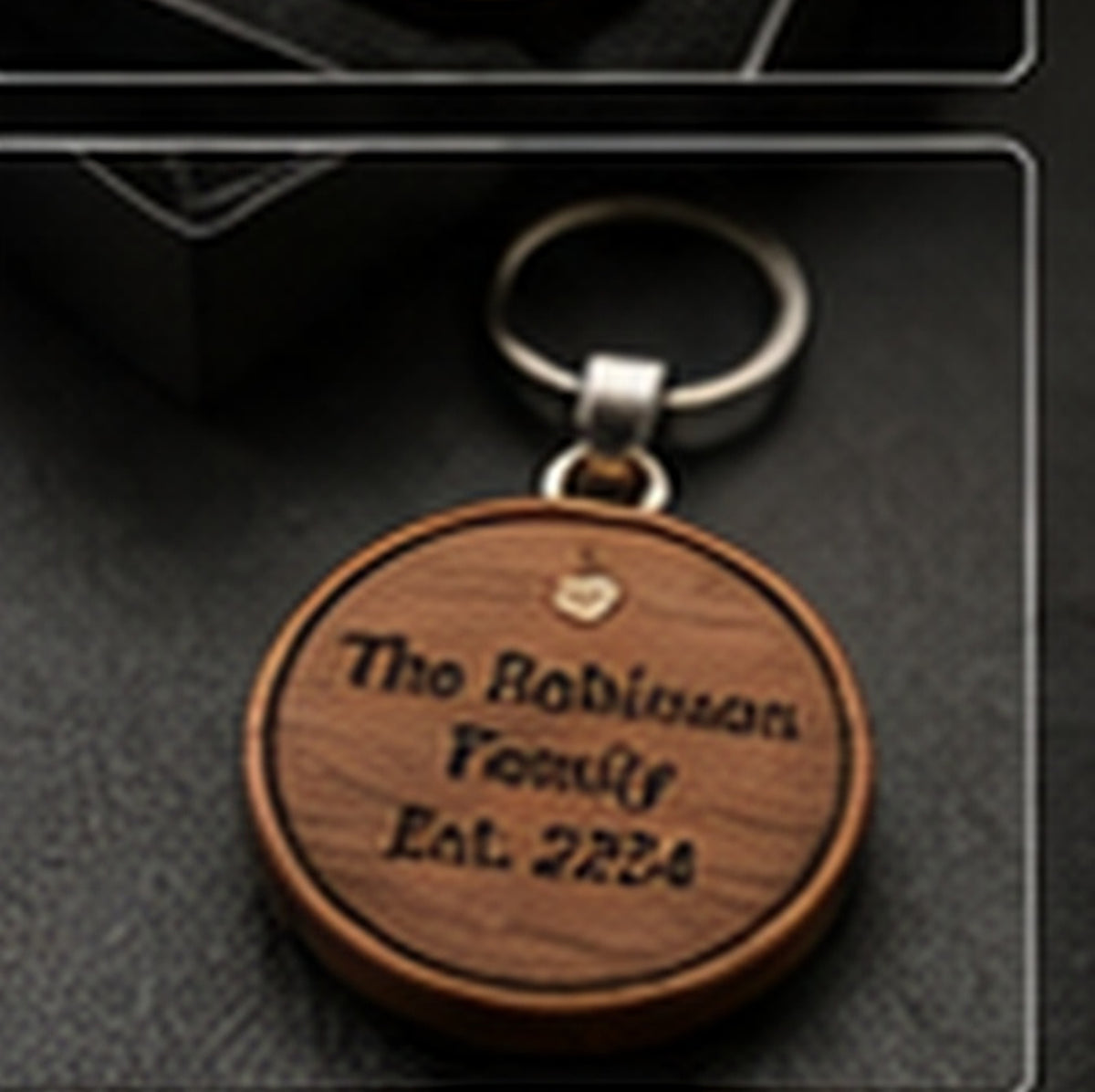 Reverse personalization and leather and metal hardware detail of family crest keychain