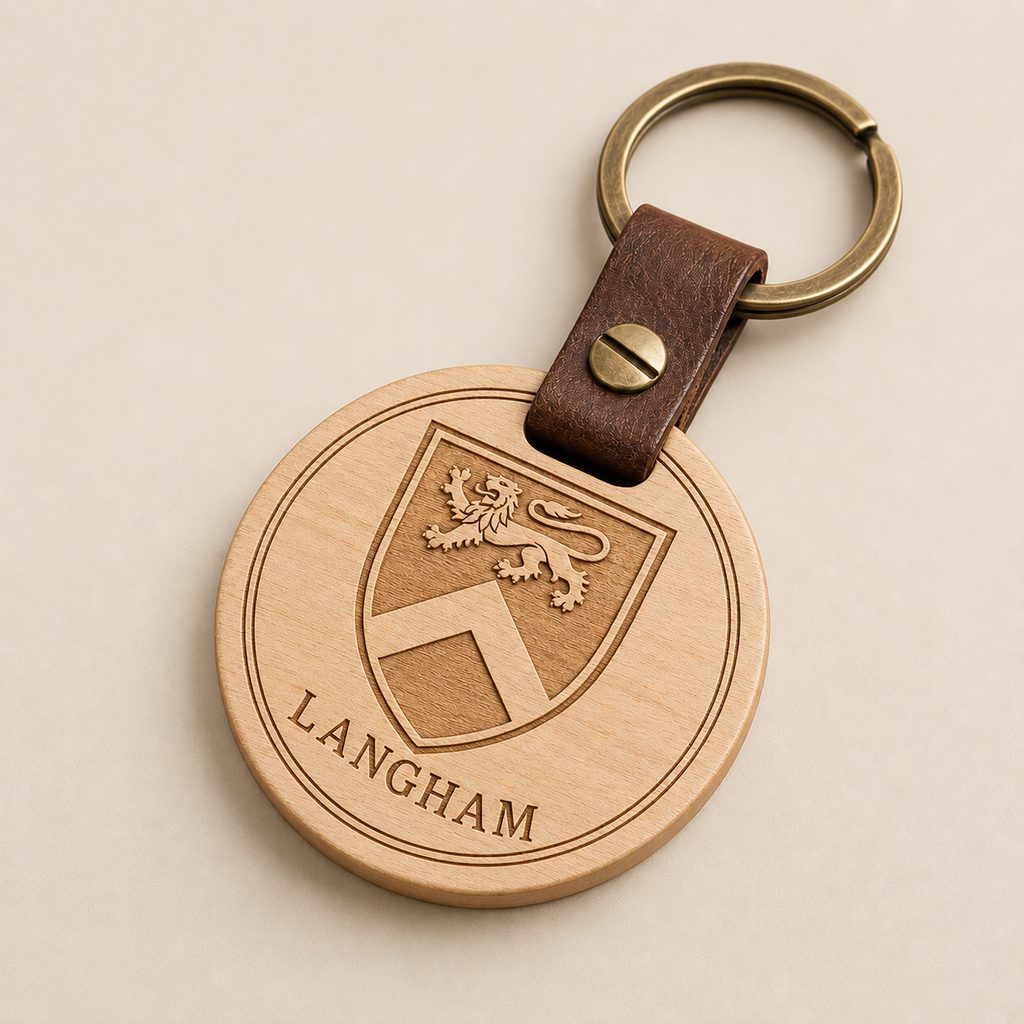 Personalized family crest keychain in Natural wood finish with leather connector and antique brass hardware