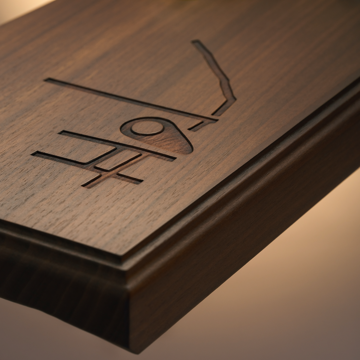 Close-up of dark walnut map heirloom sign showing precise unlabeled street-line engraving and location-pin detail