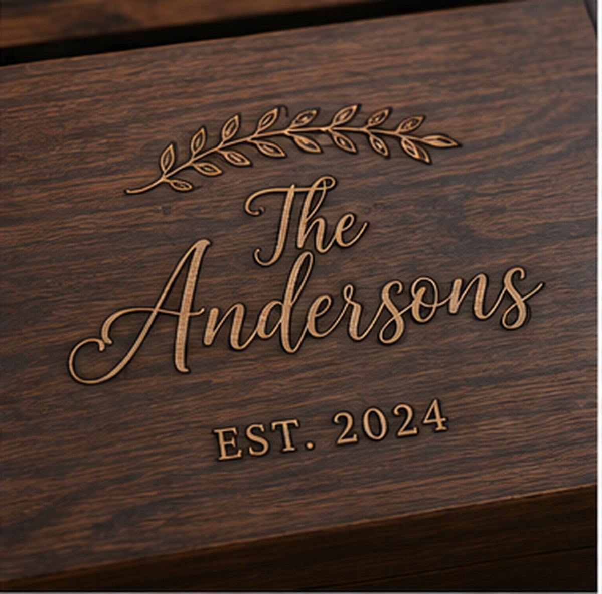Close-up personalized engraving on walnut wedding memory chest lid